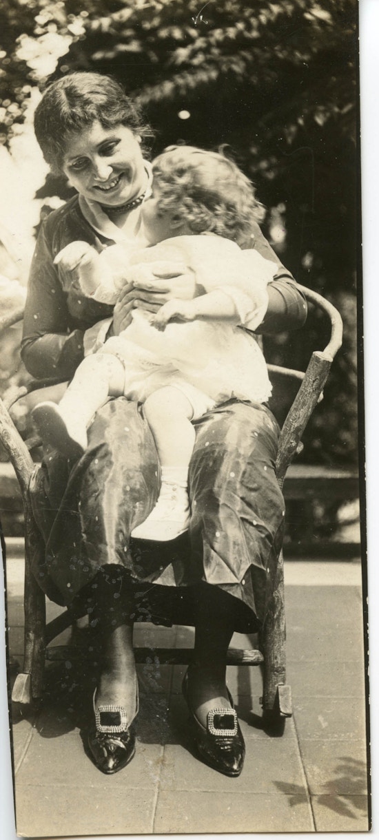 Helen Keller holding John D. Wright's baby in her lap.