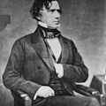 Franklin Pierce, seated, in suit, with hand inside vest.
