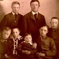 Formal portrait of seven young children with Down's Syndrome.