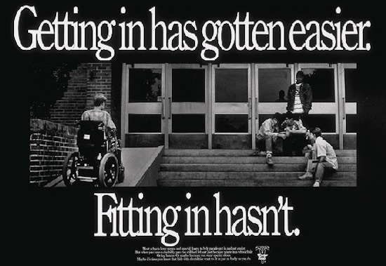 A student in a wheel chair ascends the ramp of a school while a group of other students sit on the steps "Getting in has gotten easier. Fitting in hasn't."