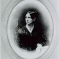 Portrait of Dorothea Dix: half-length, full face, seated, head to left, arm resting on table.