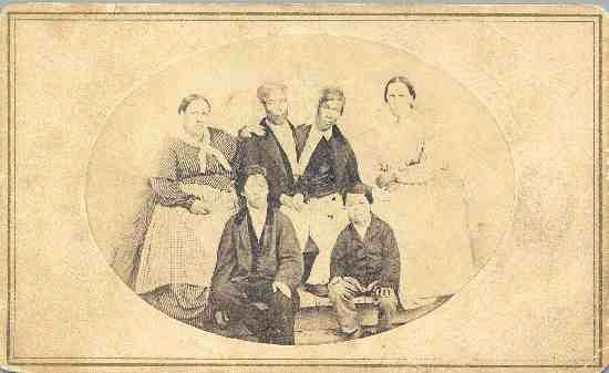 A portrait of Chang and Eng with their wives and two children.