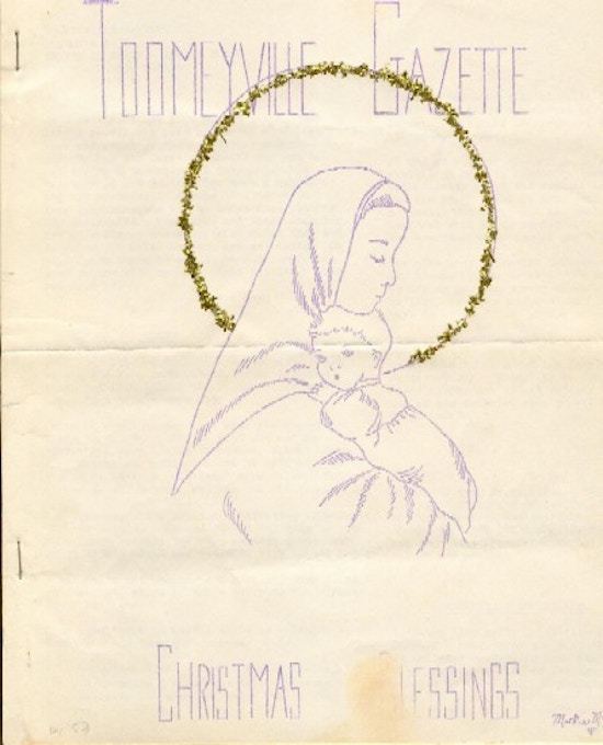 A woman holds a baby, surrounded by a halo.