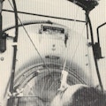 A woman types from an iron lung using her tongue.