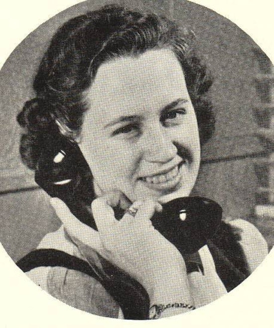 A young woman on the telephone.