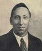 A photograph of a young man in a tie.