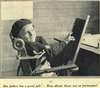 A boy sitting in a chair.