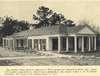 Photograph of the infirmary, a single-story building with pillars.