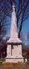A very monument with a life-size statute of Tom Thumb on top.