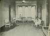 An open hall with wooden benches.