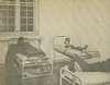 Three men restrained in beds.