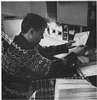 A man sorting envelopes.