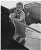 A boy in a playpen.