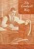 A man works at an adding machine.