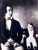 Image of young Charles Stratton sitting next to his father.