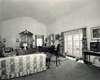 View of Top Cottage living room, including doors leading to porch.