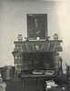 A fireplace with a portrait of Franklin Roosevelt above.