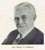 Photograph of Henry Doherty, a man with goatee and spectacles.