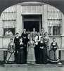 Fourteen women pose on the steps of the Willard Asylum.