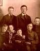 Formal portrait of seven young children with Down's Syndrome.