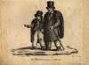 Full frontal view of a blind man and young boy who are both wearing mat capes and aprons