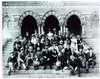 A group of men and women sit on the steps of Chapel Hall at the National Deaf-Mute College ( later renamed Gallaudet University ).