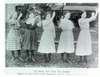 Five young women standing on the grounds of Vancouver, Washington School for the Deaf sign the hymn Nearer My God, To Thee.