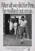 A young boy walks out of a hospital entrance way as a doctor and nurse wave good-bye.