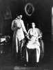Woman in wheelchair having her pulse taken by nurse
