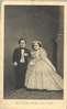 Full frontal view of Mr. and Mrs. Thumb in their wedding clothes.