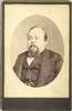 Bust view, oval format, of Tom Thumb in his later years, with beard and wearing coat and vest.