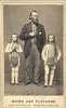 An average-sized man stands between two short-statured men with long hair and beards.
