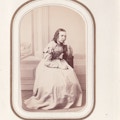 Miss Bertha Kerstow seated, face resting on hand.