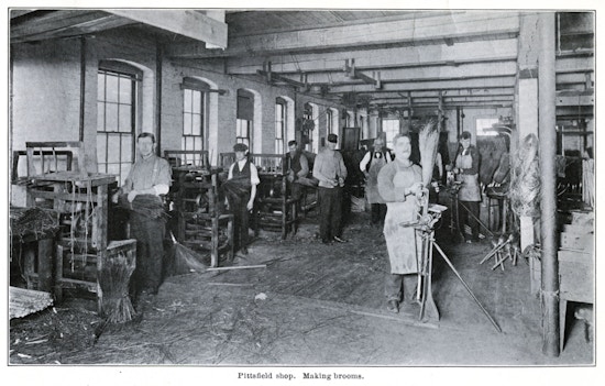 Seven men working in the Pittsfield Broom Making workshop.