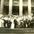 American Association To Promote Teaching Speech To The Deaf 1906 meeting group photograph taken on stairs with large columns in background.