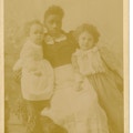Nurse holding Mildred and Philips Brooks Keller in Tuscumbia, Alabama.