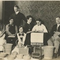 Group photograph of male and female visually impaired basket weavers, photographed with baskets.
