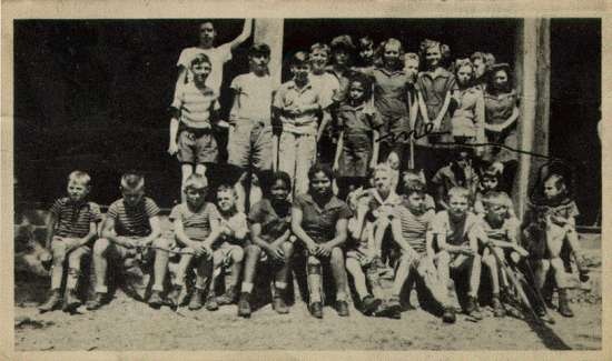 Group photo of children at Camp Daddy Allen.  One child is circled in pen on the photograph and labelled "Me."