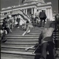 Photograph of ADA protestors crawling up Capitol Builidng steps.