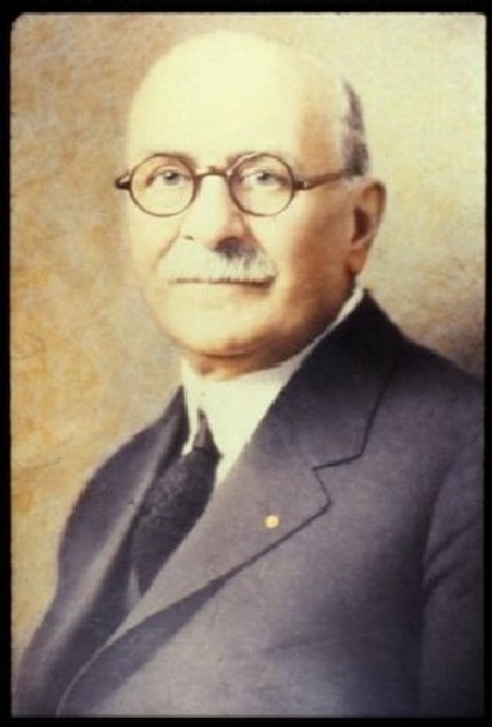 Portrait of Edgar Fiske Allen -- well-dressed man; mustachioed, glasses, balding.