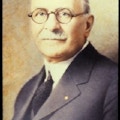 Portrait of Edgar Fiske Allen -- well-dressed man; mustachioed, glasses, balding.