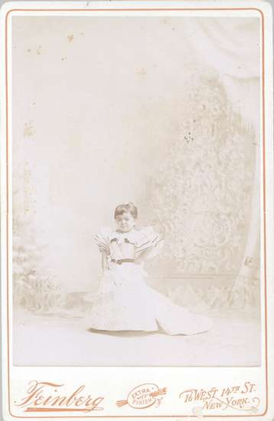 Full frontal portrait of Mrs. Tom Thumb in dress.