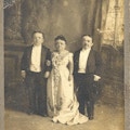 Three short-statured people, including Lavinia Warren, dressed formally.