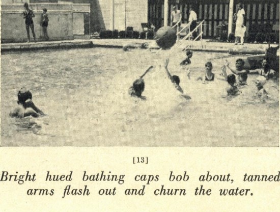 Boys play in a pool with a large ball.