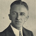 A photograph of a young man wearing a tie.