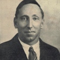 A photograph of a young man in a tie.