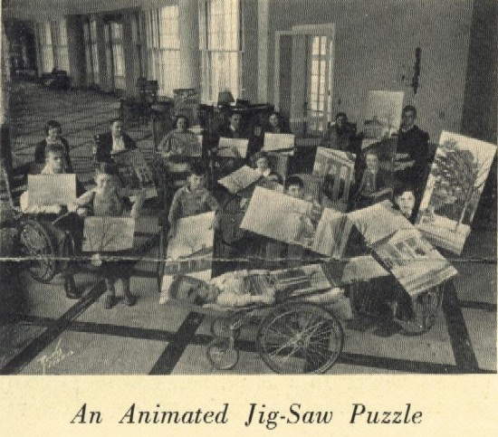 Children in wheelchairs work on a puzzle of Georgia Hall at Warm Springs.