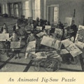Children in wheelchairs work on a puzzle of Georgia Hall at Warm Springs.