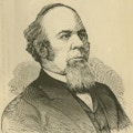 A portrait of Andrew McFarland, a middle-age man with a beard.
