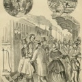 Men carry a woman to a waiting train while a crowd looks on.
